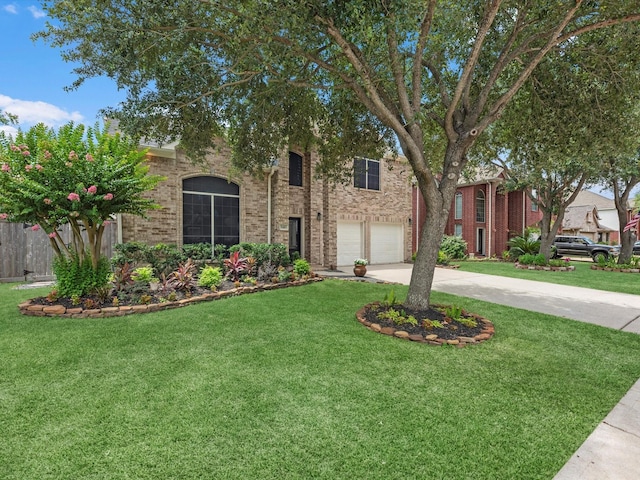 5410 Bur Oak Dr, Pasadena, TX 77505 - view of front of property featuring concrete driveway, an attached garage, and brick siding
