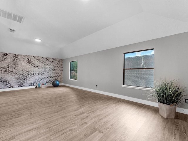 5410 Bur Oak Dr, Pasadena, TX 77505 - spare room with lofted ceiling and wood finished floors