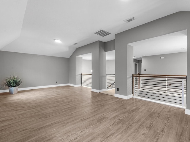 5410 Bur Oak Dr, Pasadena, TX 77505 - spare room with vaulted ceiling and wood finished floors