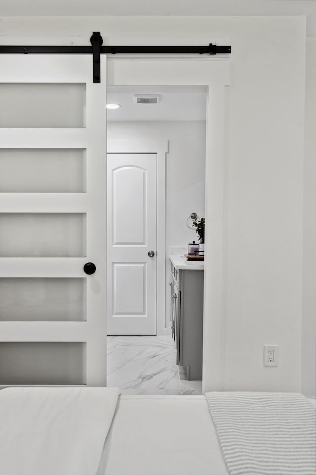 interior space with visible vents and a barn door