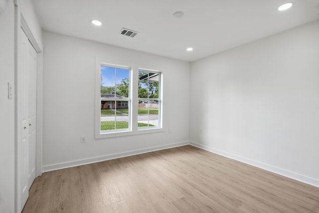 unfurnished bedroom featuring recessed lighting, visible vents, and light wood-type flooring