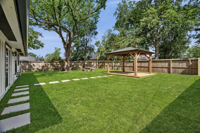 view of yard with a fenced backyard and a gazebo