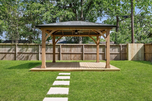 view of yard with a fenced backyard, a gazebo, and a deck