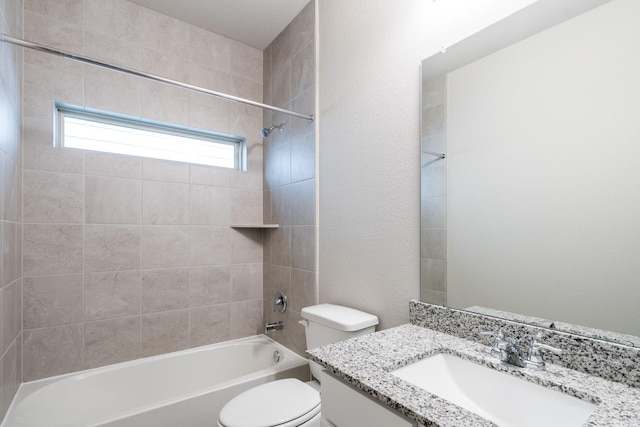 bathroom featuring vanity, bathing tub / shower combination, and toilet