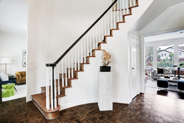 staircase featuring baseboards