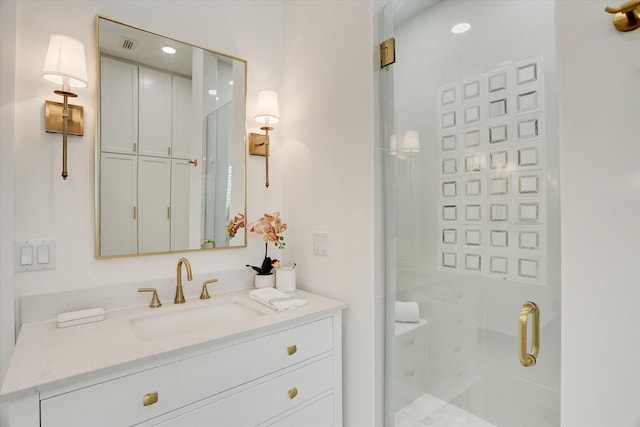 full bathroom with vanity, visible vents, and a stall shower
