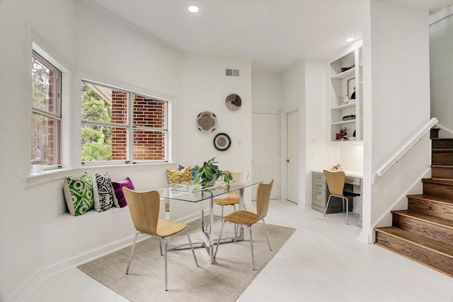 dining space featuring visible vents, recessed lighting, and stairway