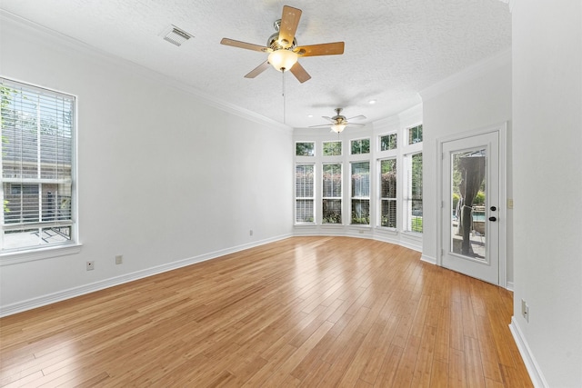 23056 Volga Dr, Porter, TX 77365 - unfurnished room with a ceiling fan, a textured ceiling, visible vents, and a healthy amount of sunlight