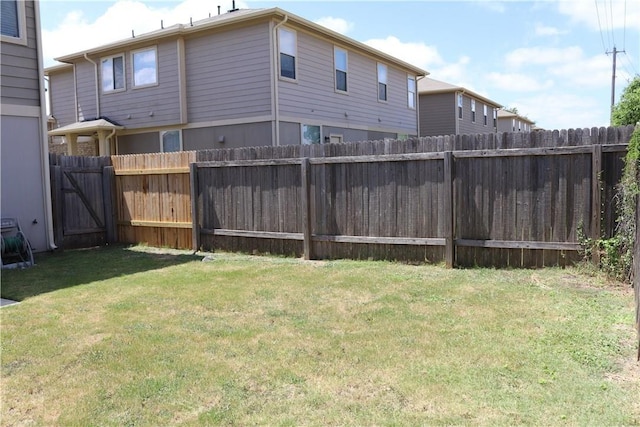 view of yard with a fenced backyard