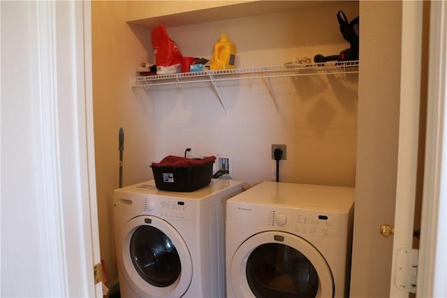 laundry area with independent washer and dryer and laundry area