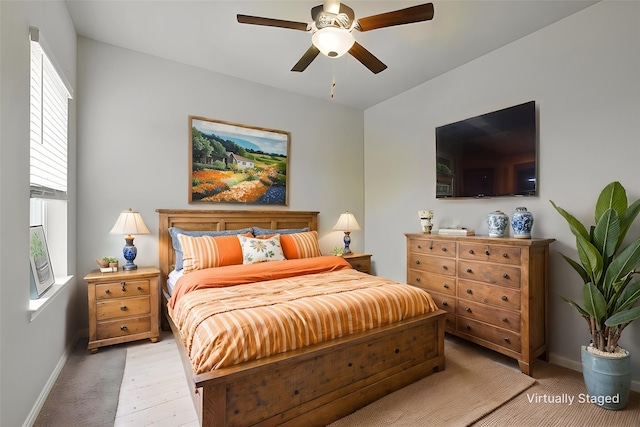 bedroom featuring ceiling fan and baseboards