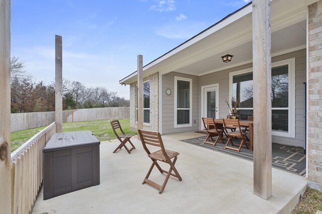 view of patio / terrace with outdoor dining area and fence private yard