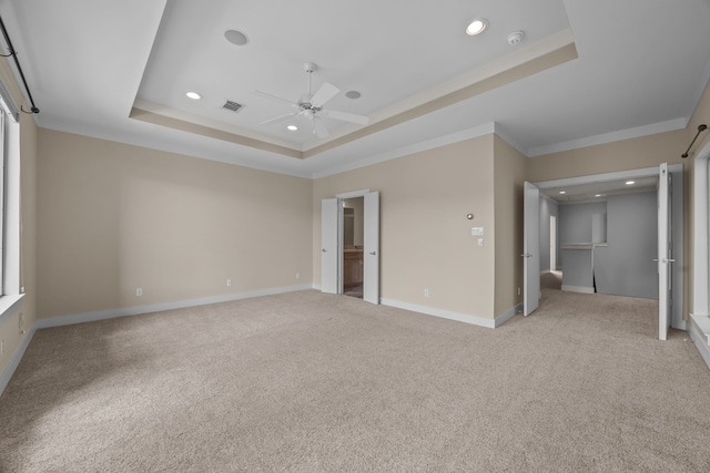 5212 Lillian St, Houston, TX 77007 - unfurnished bedroom featuring a raised ceiling, ornamental molding, light carpet, recessed lighting, and baseboards