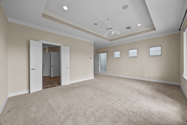 5212 Lillian St, Houston, TX 77007 - unfurnished bedroom featuring a tray ceiling, carpet floors, baseboards, recessed lighting, and crown molding