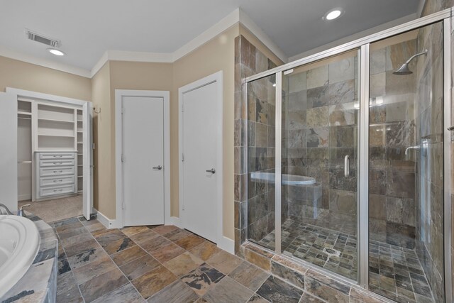 5212 Lillian St, Houston, TX 77007 - bathroom with a stall shower, a bath, a spacious closet, stone finish floors, and baseboards