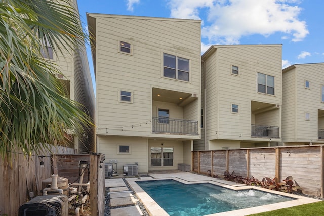 5212 Lillian St, Houston, TX 77007 - rear view of property with central air condition unit, a balcony, and a fenced backyard