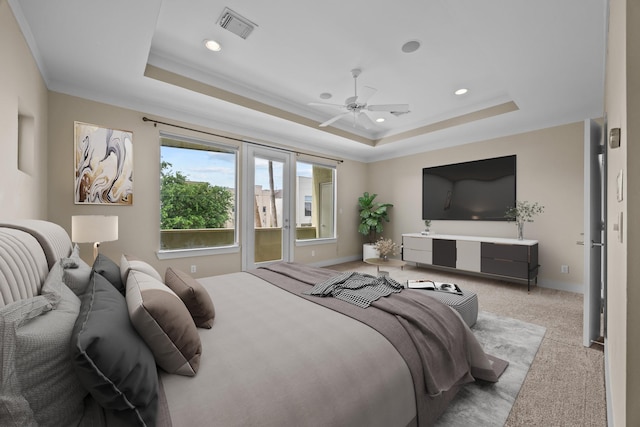 5212 Lillian St, Houston, TX 77007 - carpeted bedroom with a tray ceiling, recessed lighting, and ceiling fan