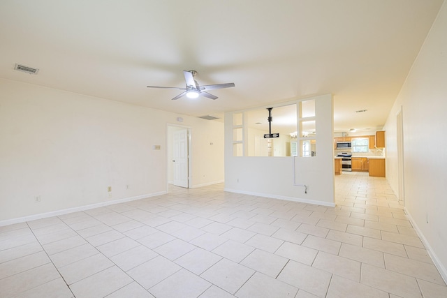 5003 Lord Rd, Crosby, TX 77532 - spare room featuring ceiling fan, baseboards, visible vents, and light tile patterned floors