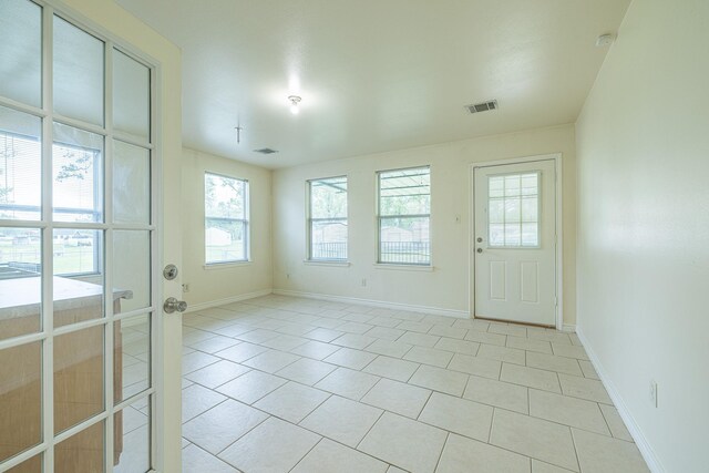 5003 Lord Rd, Crosby, TX 77532 - spare room with baseboards, visible vents, and light tile patterned floors
