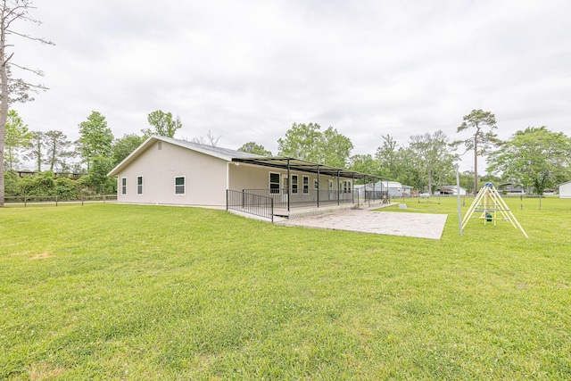 5003 Lord Rd, Crosby, TX 77532 - rear view of house featuring a lawn, fence, and a patio