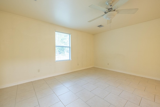 5003 Lord Rd, Crosby, TX 77532 - empty room with visible vents, a ceiling fan, baseboards, and light tile patterned floors