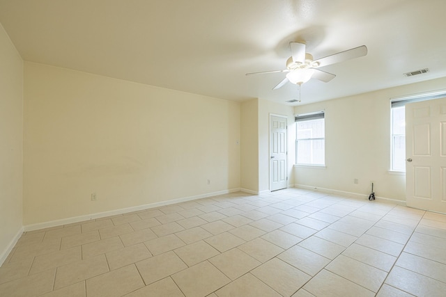 5003 Lord Rd, Crosby, TX 77532 - empty room with baseboards, a ceiling fan, visible vents, and light tile patterned flooring