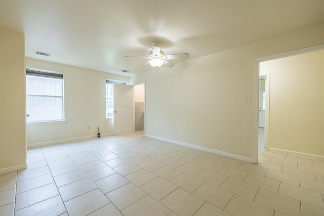 5003 Lord Rd, Crosby, TX 77532 - unfurnished room featuring ceiling fan, baseboards, light tile patterned flooring, and visible vents