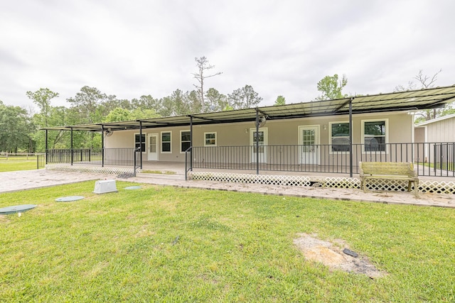 5003 Lord Rd, Crosby, TX 77532 - back of property with a yard and a carport