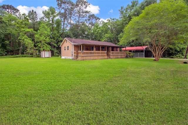 exterior space featuring a storage unit, a yard, and an outbuilding