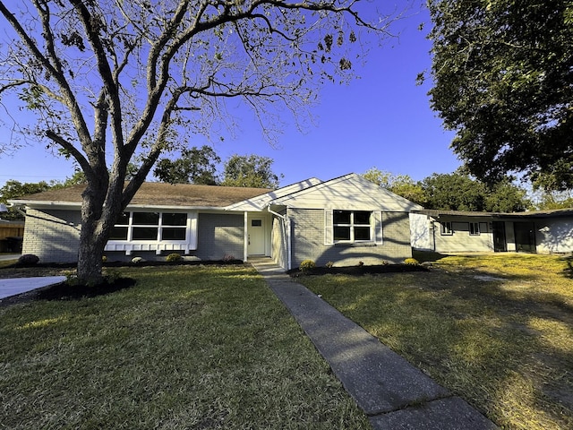 5814 W Bellfort Ave, Houston, TX 77035 - view of front of house featuring a front lawn and brick siding