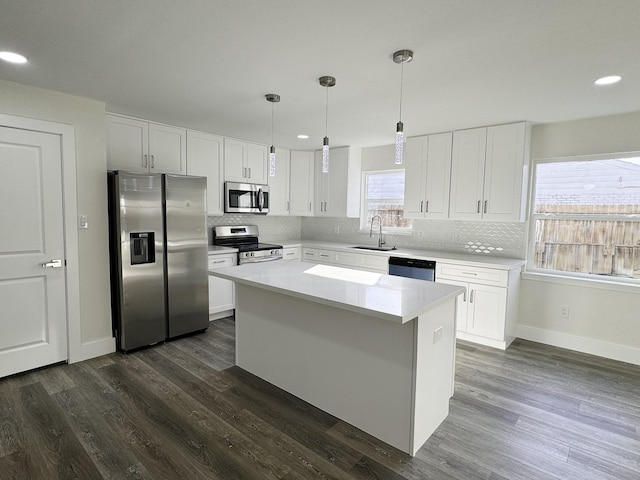 5814 W Bellfort Ave, Houston, TX 77035 - kitchen featuring stainless steel appliances, a sink, recessed lighting, and tasteful backsplash