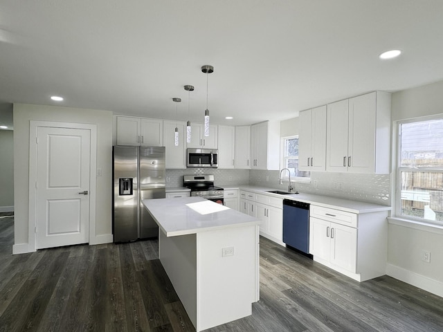 5814 W Bellfort Ave, Houston, TX 77035 - kitchen with backsplash, baseboards, stainless steel appliances, and a sink