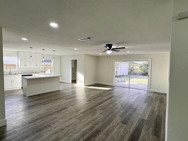 5814 W Bellfort Ave, Houston, TX 77035 - unfurnished living room featuring baseboards, a ceiling fan, visible vents, and recessed lighting