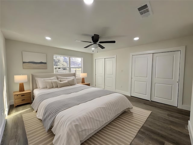 5814 W Bellfort Ave, Houston, TX 77035 - bedroom featuring wood finished floors, multiple closets, visible vents, and recessed lighting