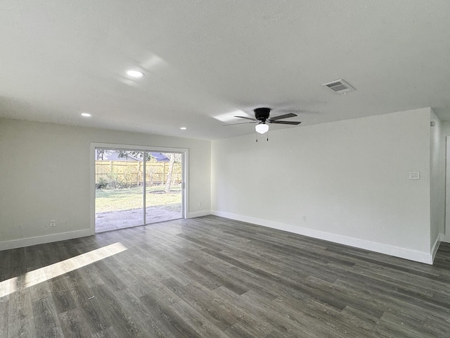 5814 W Bellfort Ave, Houston, TX 77035 - spare room featuring ceiling fan, dark wood finished floors, baseboards, visible vents, and recessed lighting