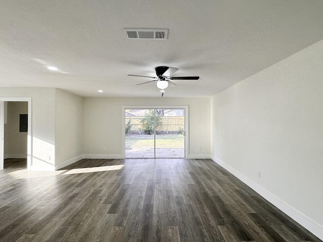 5814 W Bellfort Ave, Houston, TX 77035 - empty room with dark wood finished floors, visible vents, a ceiling fan, and baseboards