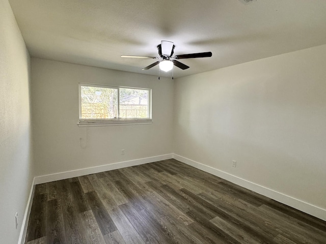 5814 W Bellfort Ave, Houston, TX 77035 - spare room featuring a ceiling fan, baseboards, and dark wood finished floors