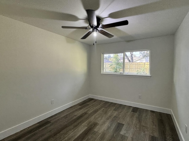 5814 W Bellfort Ave, Houston, TX 77035 - spare room featuring baseboards, a ceiling fan, and dark wood-style floors
