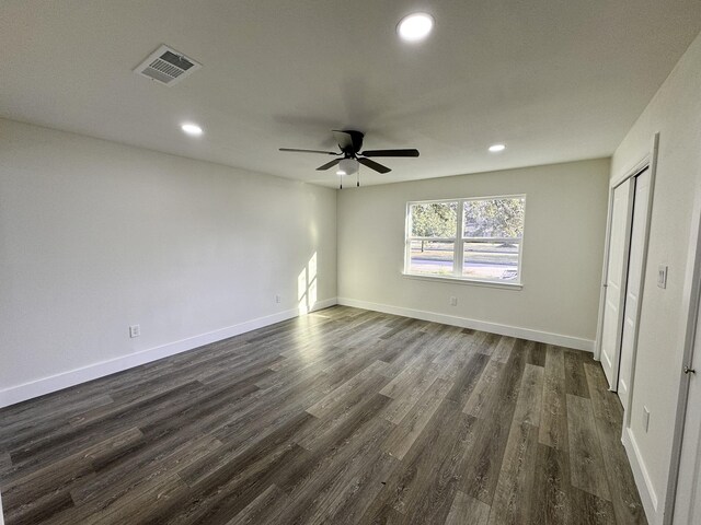 5814 W Bellfort Ave, Houston, TX 77035 - unfurnished bedroom with dark wood finished floors, baseboards, visible vents, and recessed lighting