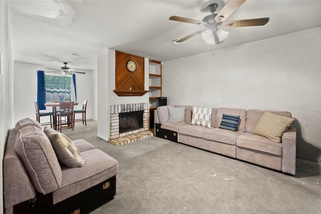 living area with a fireplace, concrete floors, a ceiling fan, and visible vents