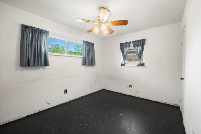 unfurnished room featuring ceiling fan