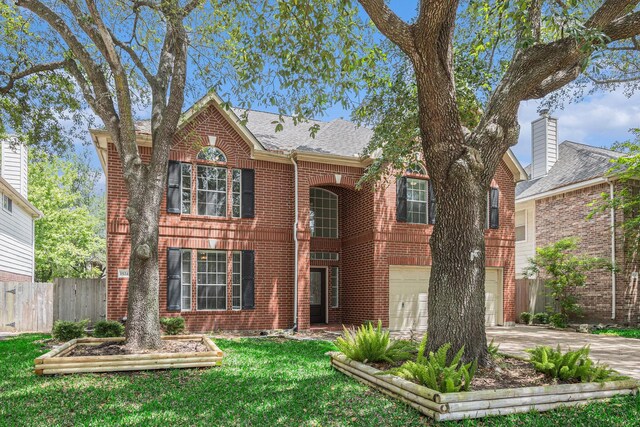 15242 Shapiro Springs Ln, Houston, TX 77095 - view of front of home featuring concrete driveway, brick siding, a garage, and roof with shingles