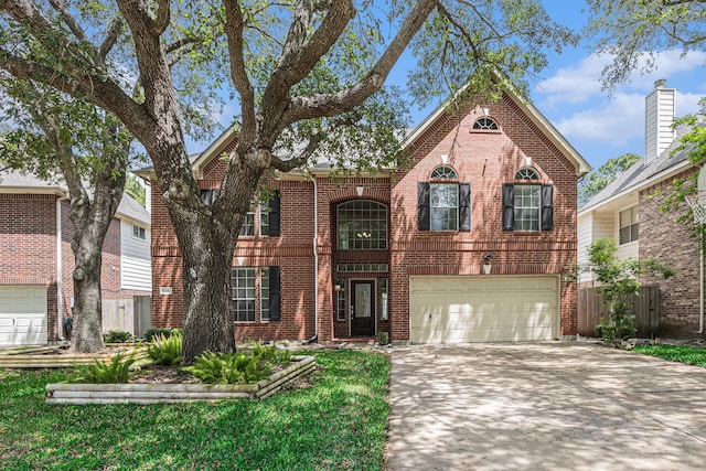15242 Shapiro Springs Ln, Houston, TX 77095 - view of front facade with driveway, an attached garage, brick siding, and fence