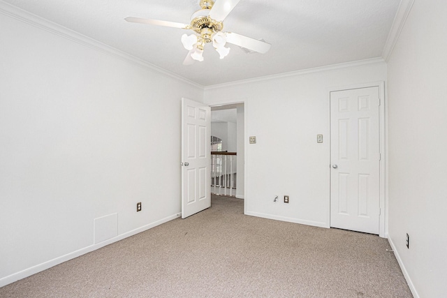 15242 Shapiro Springs Ln, Houston, TX 77095 - empty room with ornamental molding, carpet floors, ceiling fan, and baseboards
