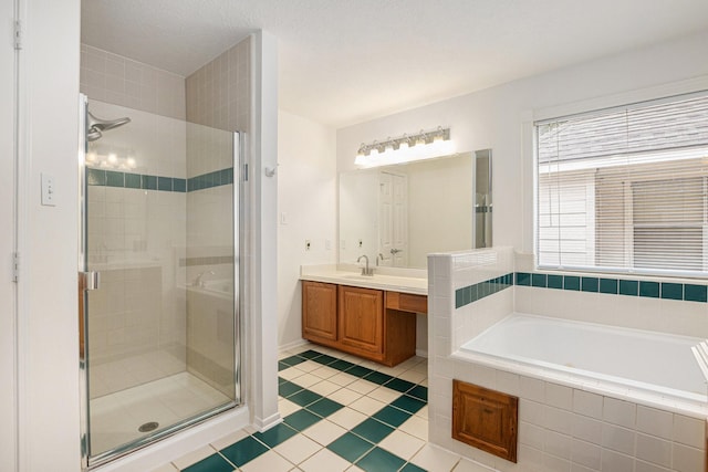 15242 Shapiro Springs Ln, Houston, TX 77095 - bathroom featuring a shower stall, tile patterned flooring, a bath, and vanity