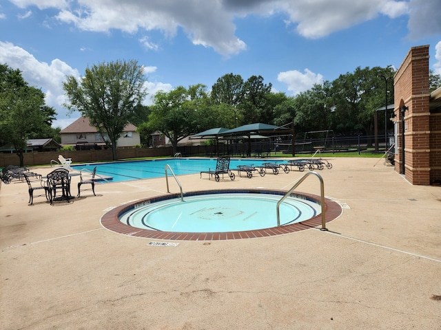 15242 Shapiro Springs Ln, Houston, TX 77095 - community pool with fence and a patio