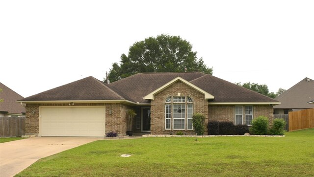 ranch-style house featuring fence, brick siding, and a garage