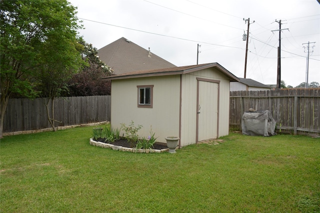 view of shed featuring a fenced backyard