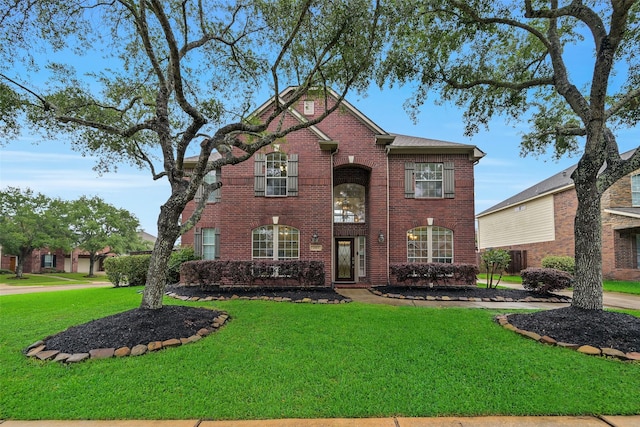 2513 Garnetfield Ln, Friendswood, TX 77546 - traditional home with a front lawn and brick siding