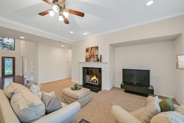 2513 Garnetfield Ln, Friendswood, TX 77546 - living room featuring crown molding, recessed lighting, a fireplace, carpet floors, and a ceiling fan